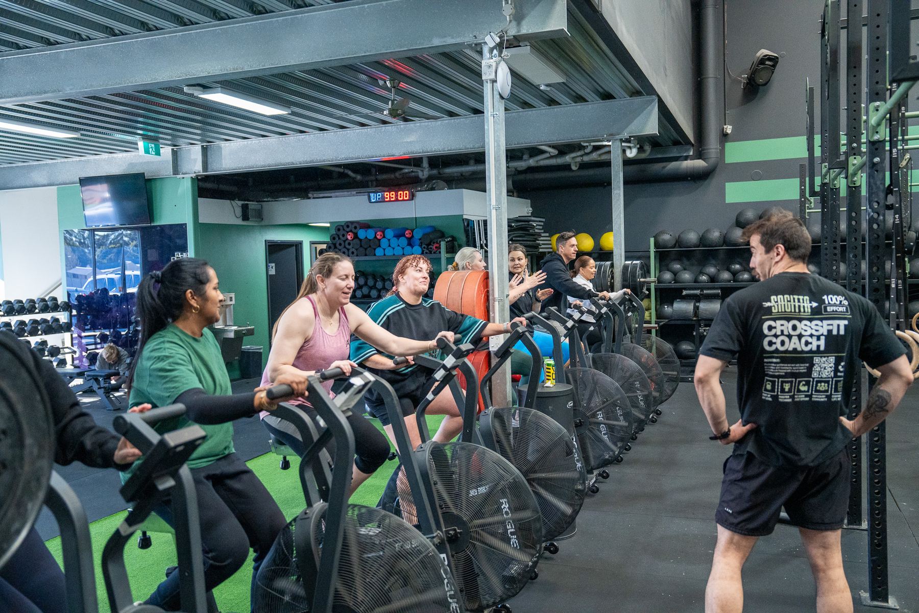 Members training on the Sagitta gym floor with a coach