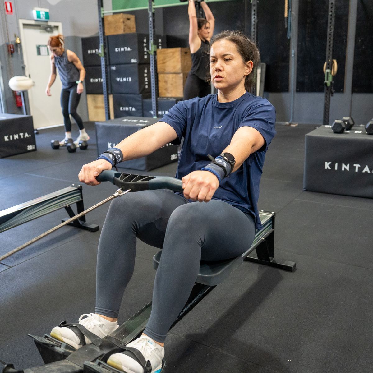 A member rowing on a Concept2 rower